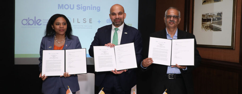 Lieutenant Governor Tahesha Way holding the signed MOU in a group photo